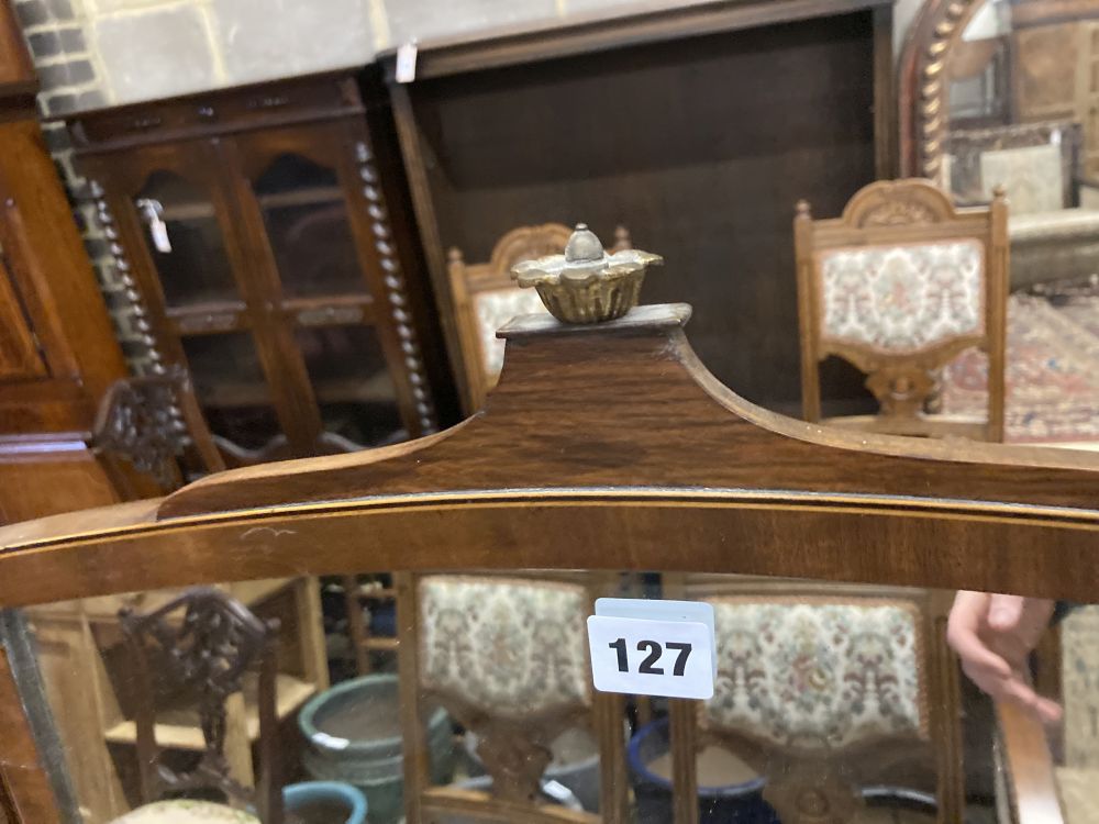 A George III mahogany and tulipwood banded bowfronted toilet mirror, on ivory ball feet, width 54cm depth 23cm height 60cm
